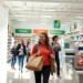 Shoppers comparing products in a clean, well-organized retail store