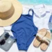 Organized beach vacation packing essentials laid out on bed