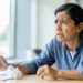 stressed professional contemplating leaving toxic workplace environment